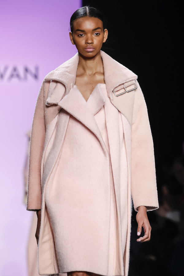 New York, NY, USA - February 13, 2016: A model walks the runway at the Son Jung Wan runway show during of Fall/Winter 2016 New York Fashion Week at The Dock, Skylight at Moynihan Station, Manhattan.